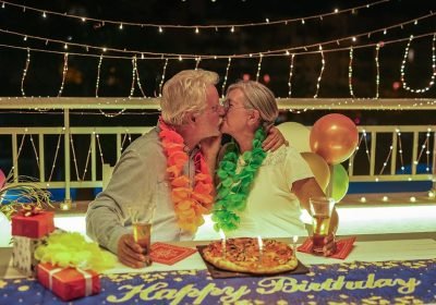 happy-family-couple-kissing-celebrating-birthday-a-2024-11-29-23-34-20-utc