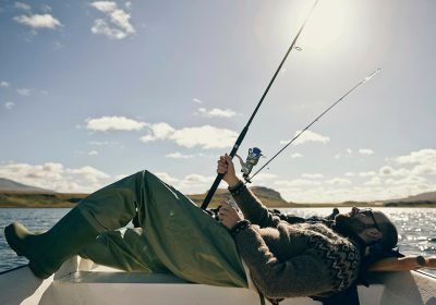 relaxed-fisherman-enjoying-a-sunny-day-on-the-lake-2024-07-09-18-20-21-utc